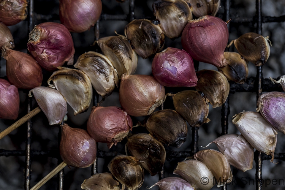 Grilling garlic and shallots to make nam prik, Bangkok