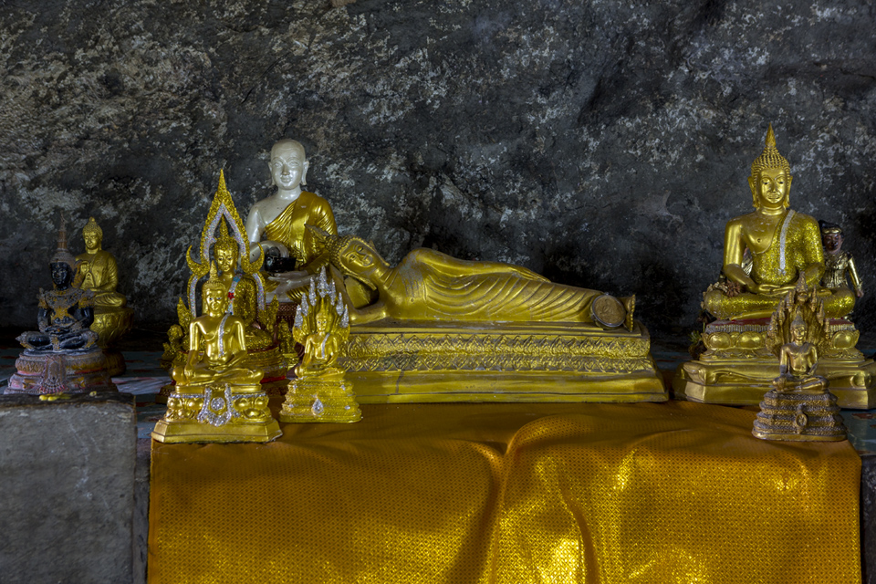 Buddha images in a cave at Wang Po Viaduct, Kanchanaburi, Thailand