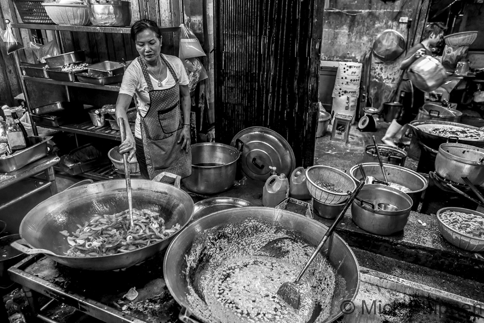 A kitchen in Klong Toey cooking food for a market stall