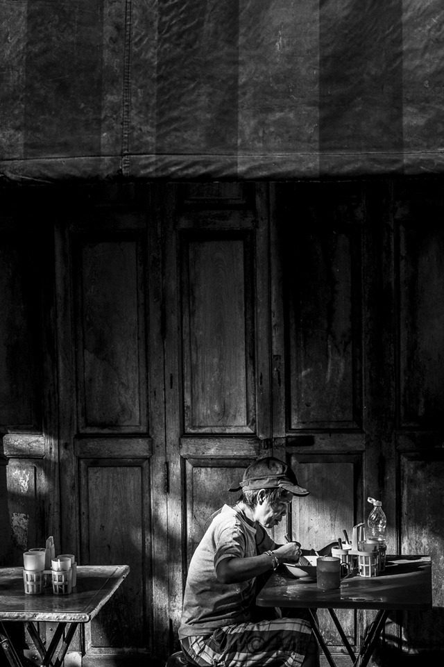 Eating a bowl of noodles in the late afternoon, Chinatown, Bangkok