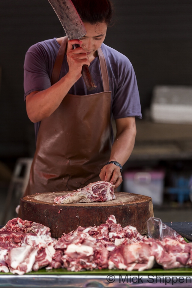 Butcher,  Chiang Rai market, Thailand