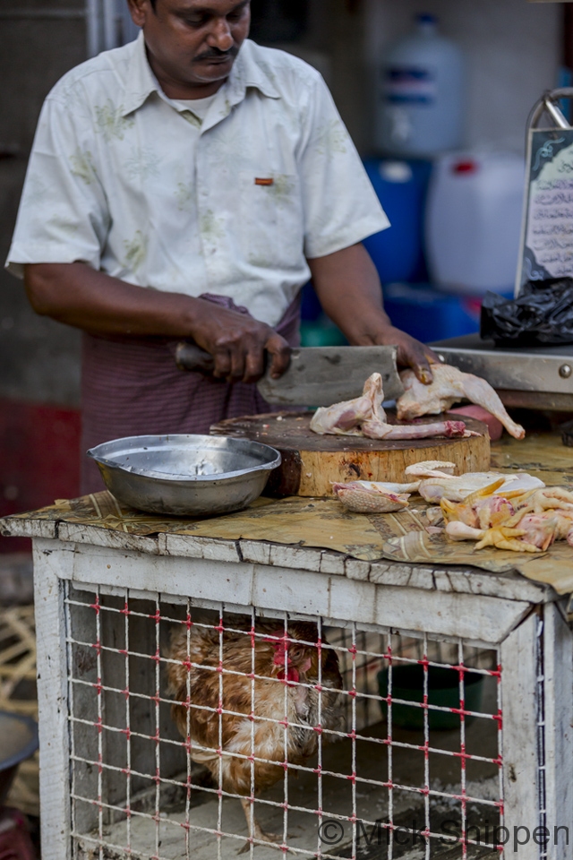 Butcher in a Yangon street market, Myanmar