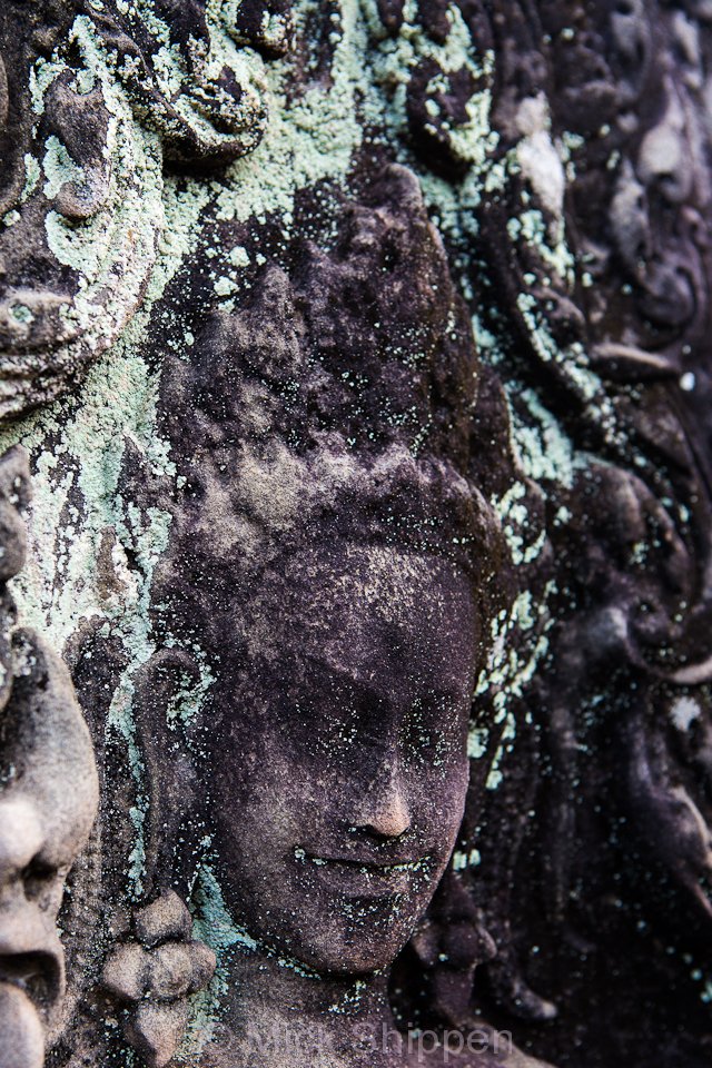 An image of an Apsara carved in stone at Angkor, Cambodia.