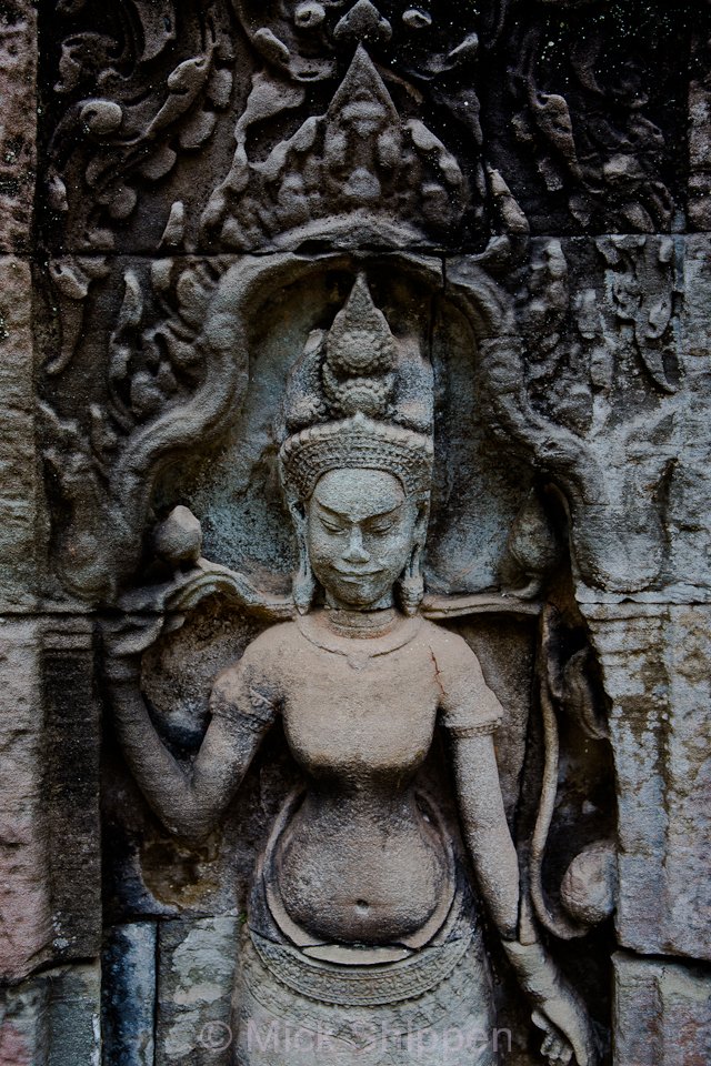 An image of an Apsara carved in stone at Angkor, Cambodia.