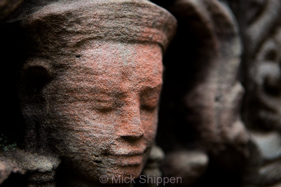 An image of an Apsara carved in stone at Angkor, Cambodia.
