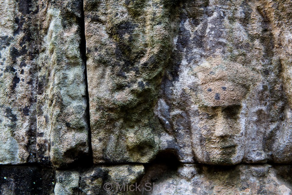 An image of an Apsara carved in stone at Angkor, Cambodia.