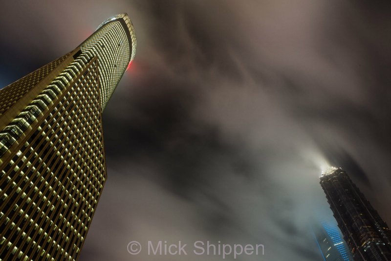 Skyscrapers on a cloudy night in Pudong, Shanghai's financial hub.