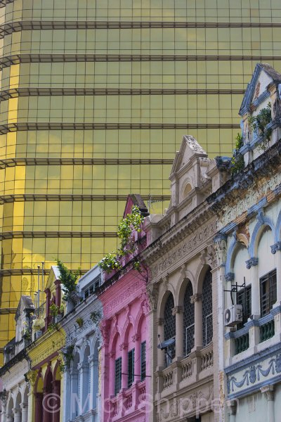 The old and new, colonial-era architecture with a skyscraper backdrop in Kual Lumpur