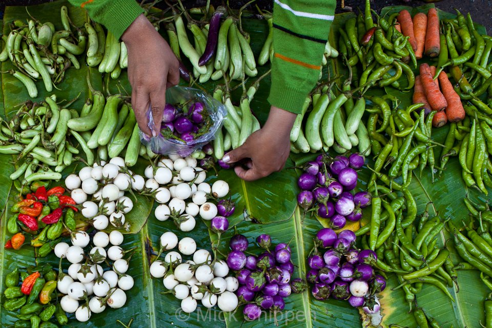 A colourful display of vegetables for sale in one of the city's many street markets.